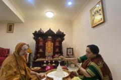 MataShree and Swamiji doing abhishek to the MahaMeru
